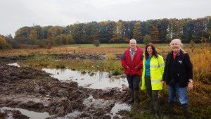 Martin Hammond, Anne Heathcote and Mick Phythian by the newly extended pond